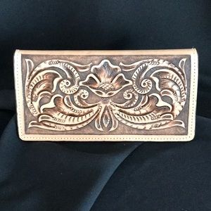 Leather hand tooled roper checkbook/wallet.